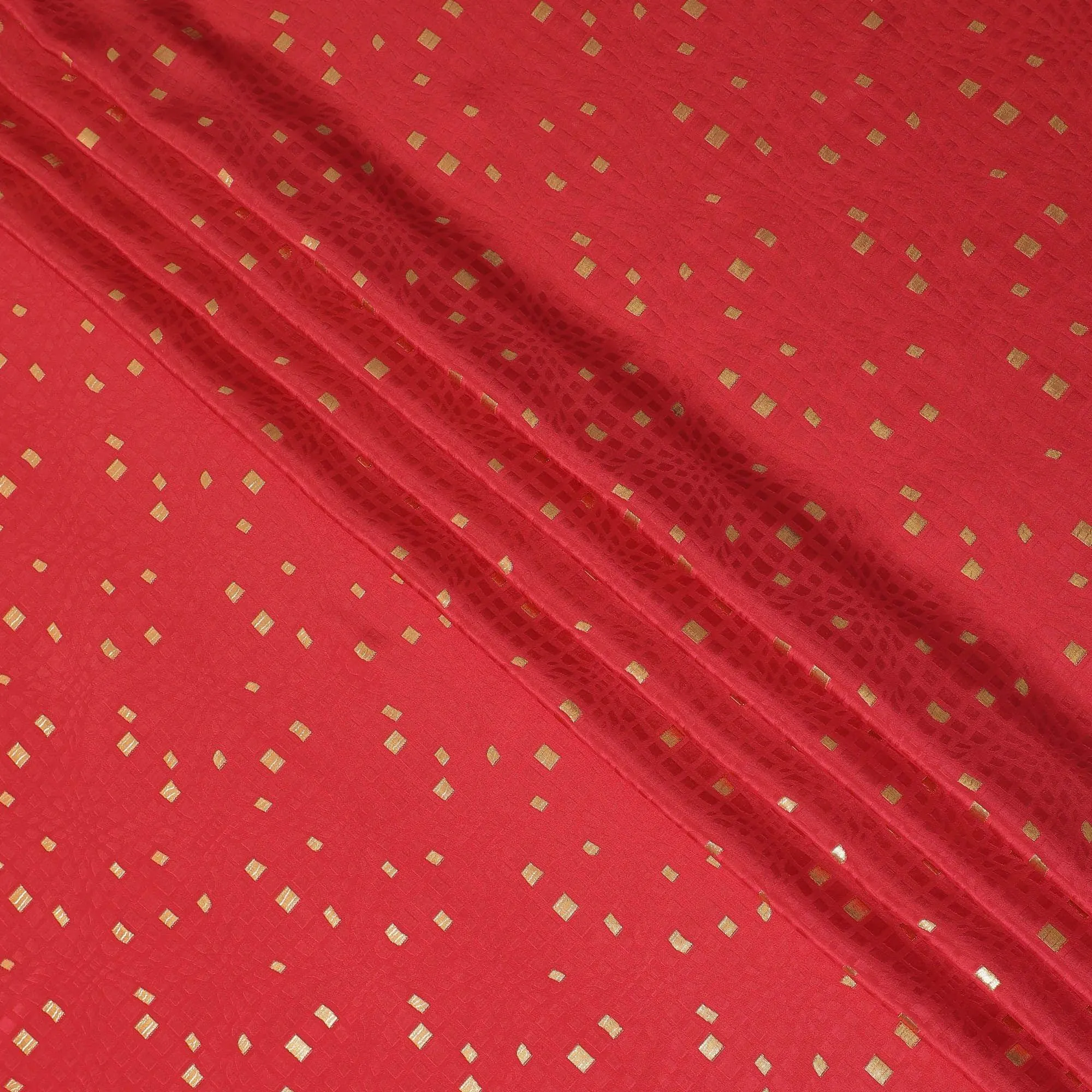Raspberry red crepe silk fabric with gold and similar color jacquard in abstract design-D15758